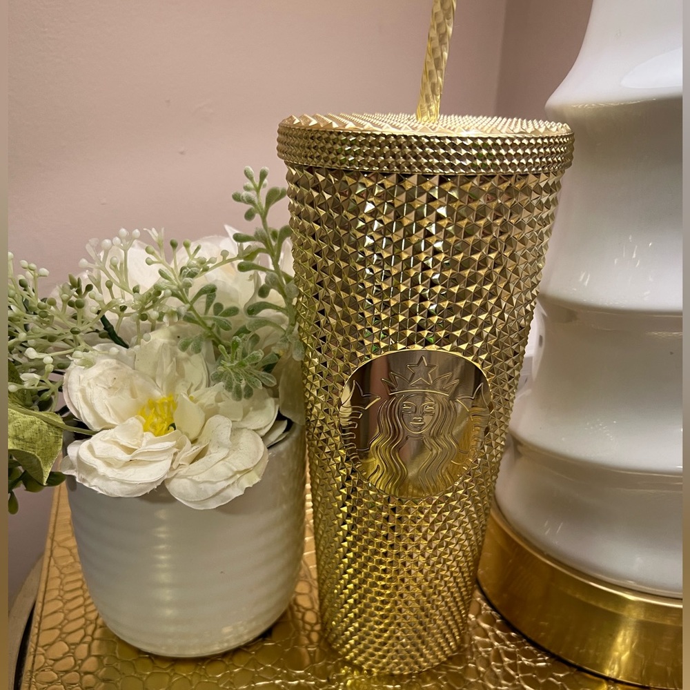 Starbucks gold Venti cup